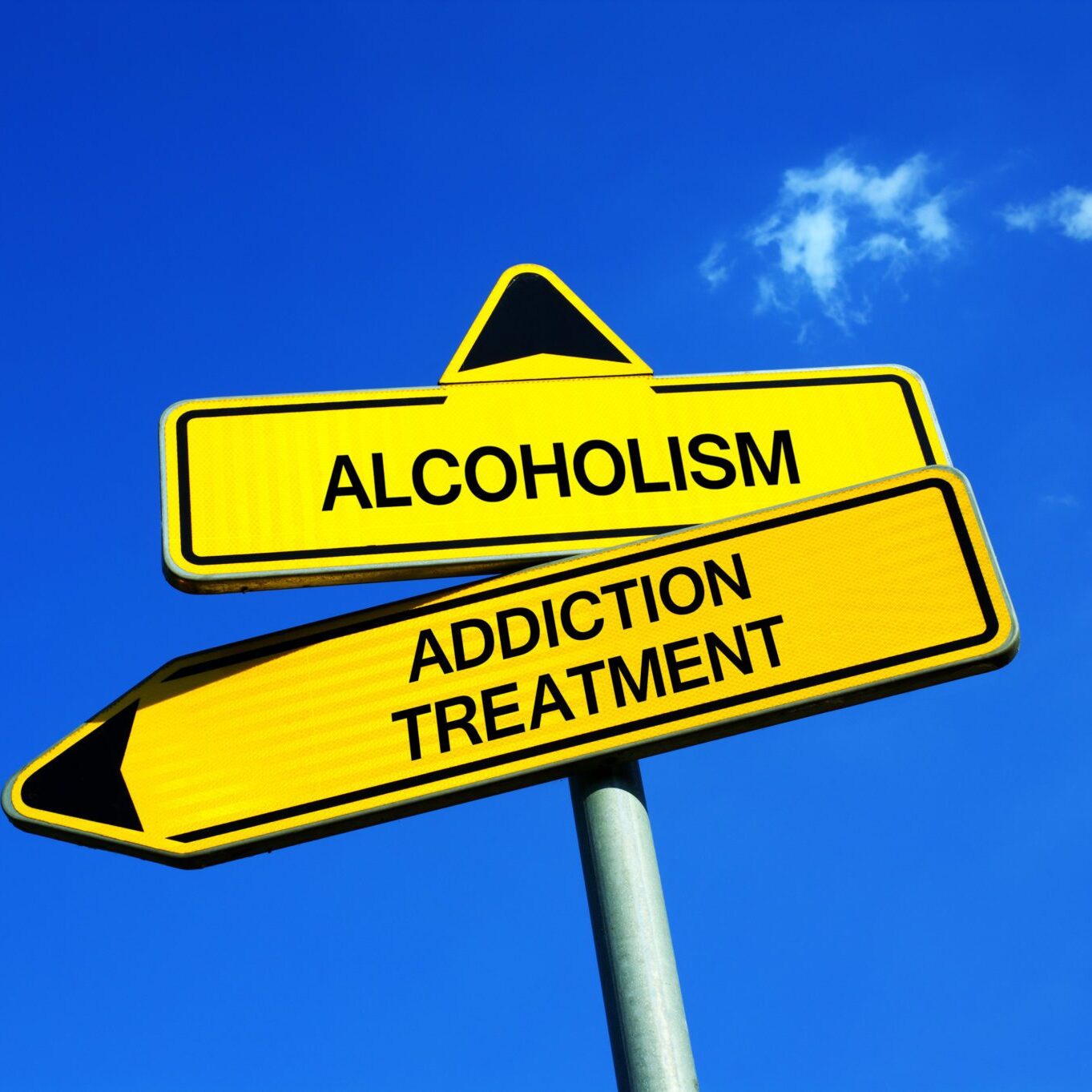 Alcoholism vs Addiction treatment - Traffic sign with two options - appeal to overcome addictive alcohol abuse and dependence through detoxifiction, treatment, rehabilitation and abstinence